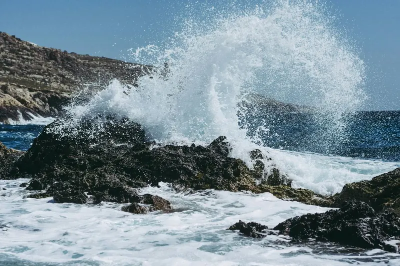 Waves breaking against a rocky coastline